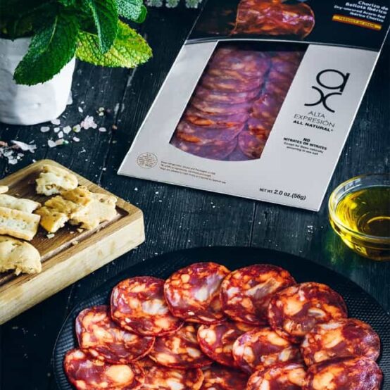 Sliced chorizo iberico in package and plate
